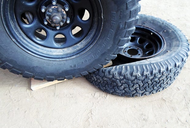 Use the 2x6 to drive up on a tire to break the bead. 