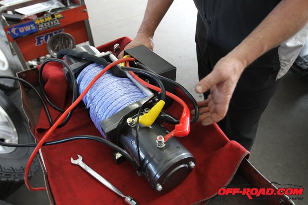 Bill Bruner of SoCal SuperTrucks set the winch on his workbench and started to connect the wiring from the solenoid box to the winch body.