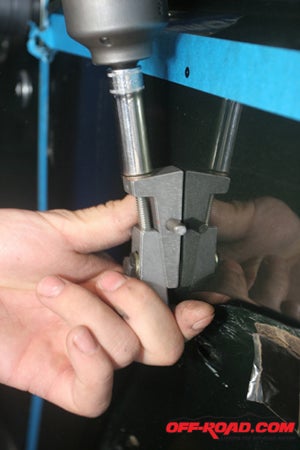 The tool easily crimps the rivet-nut to secure it to the factory sheet metal.