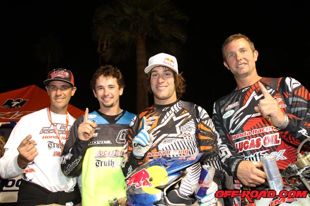 Johnny Campbell (far left) of Johnny Campbell Racing poses with his winning team: Logan Holladay (middle left), Kendall Norman (middle right) and Quinn Cody (right). 