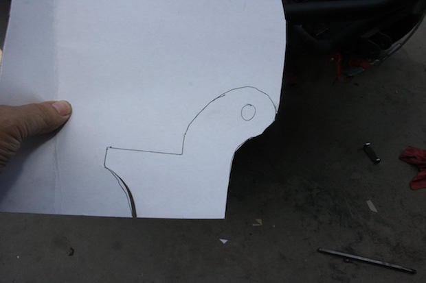 Use heavy construction paper or cardboard to make a template for the lower mounts. Cut from at least ¼-inch steel plate. Modify it until it fits perfectly and then weld into place. Weld both sides so that it can withstand the stresses that will be put upon it.