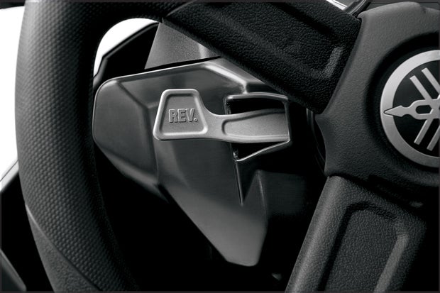 The reverse lever sits behind the steering wheel, making it nearly impossible to accidentally engage it while driving.